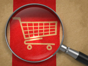 Magnifying Glass with Shopping Cart Icon.